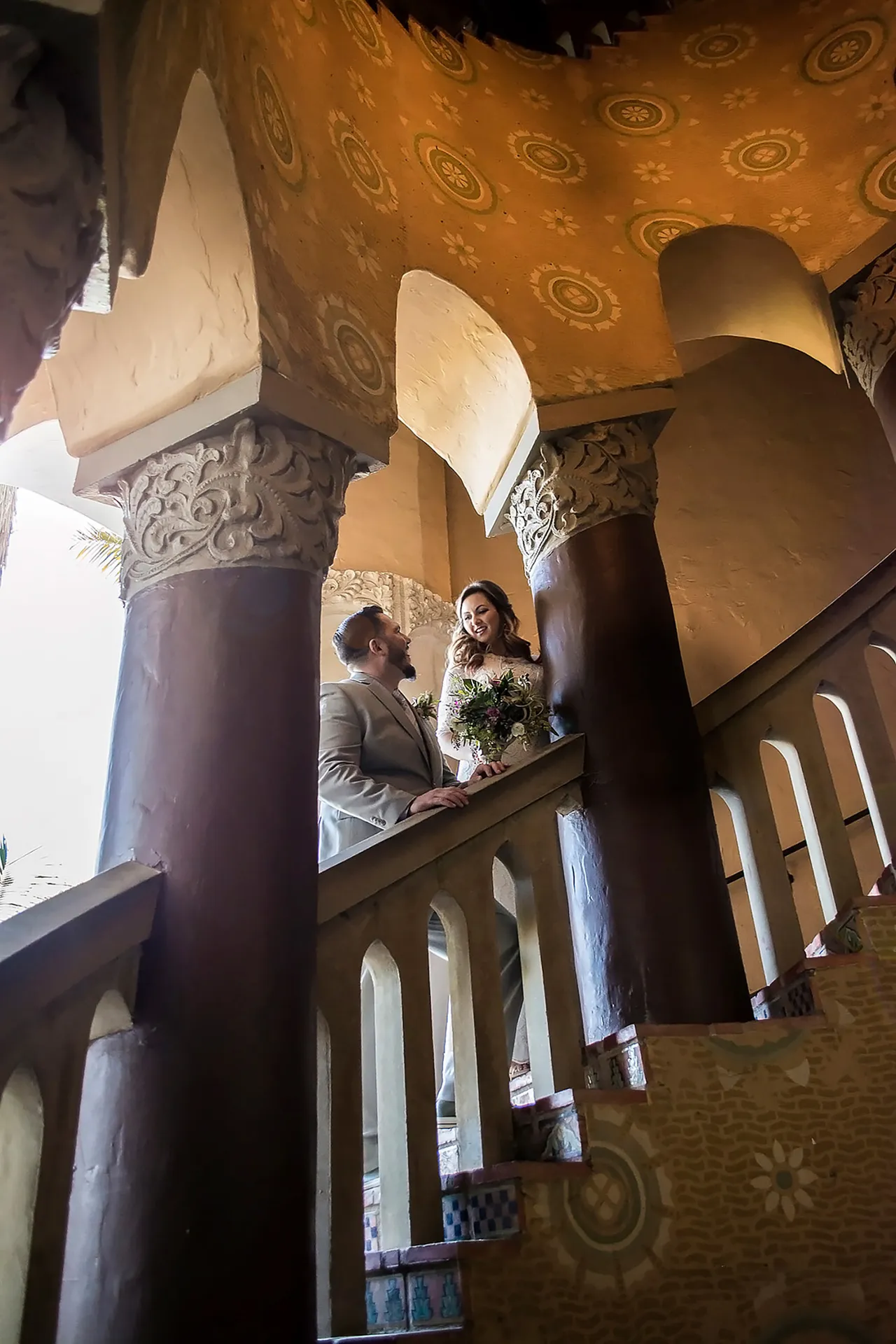 Couple posed on an ornate stone staircase, Santa Barbara